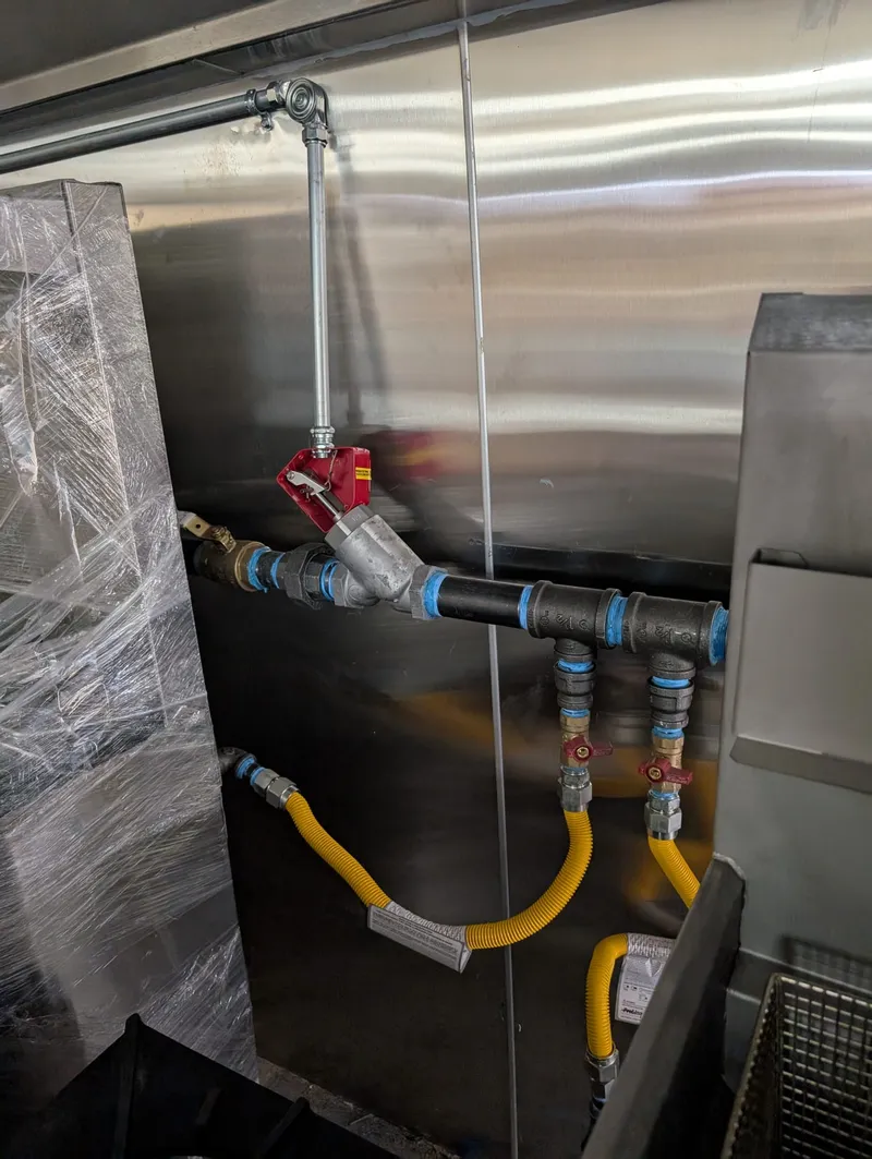 Fire suppression gas valves installed to supply kitchen equipment in a commercial building