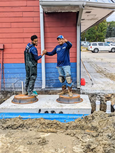 Diamond State Plumbing team after completing a grease trap installation