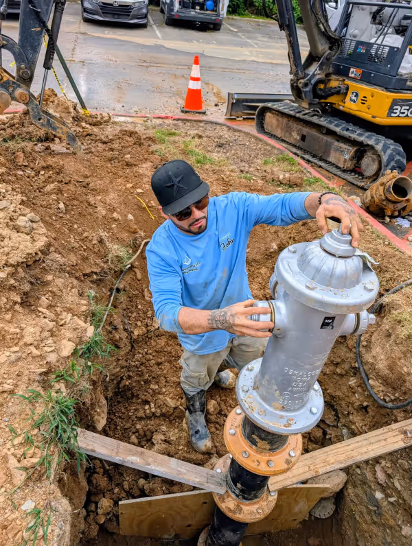 Diamond State Plumbing technician installing a fire hydrant