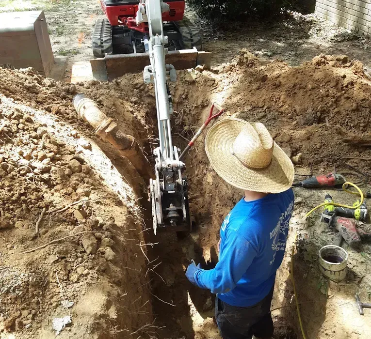 Excavated trench with old and new water service lines
