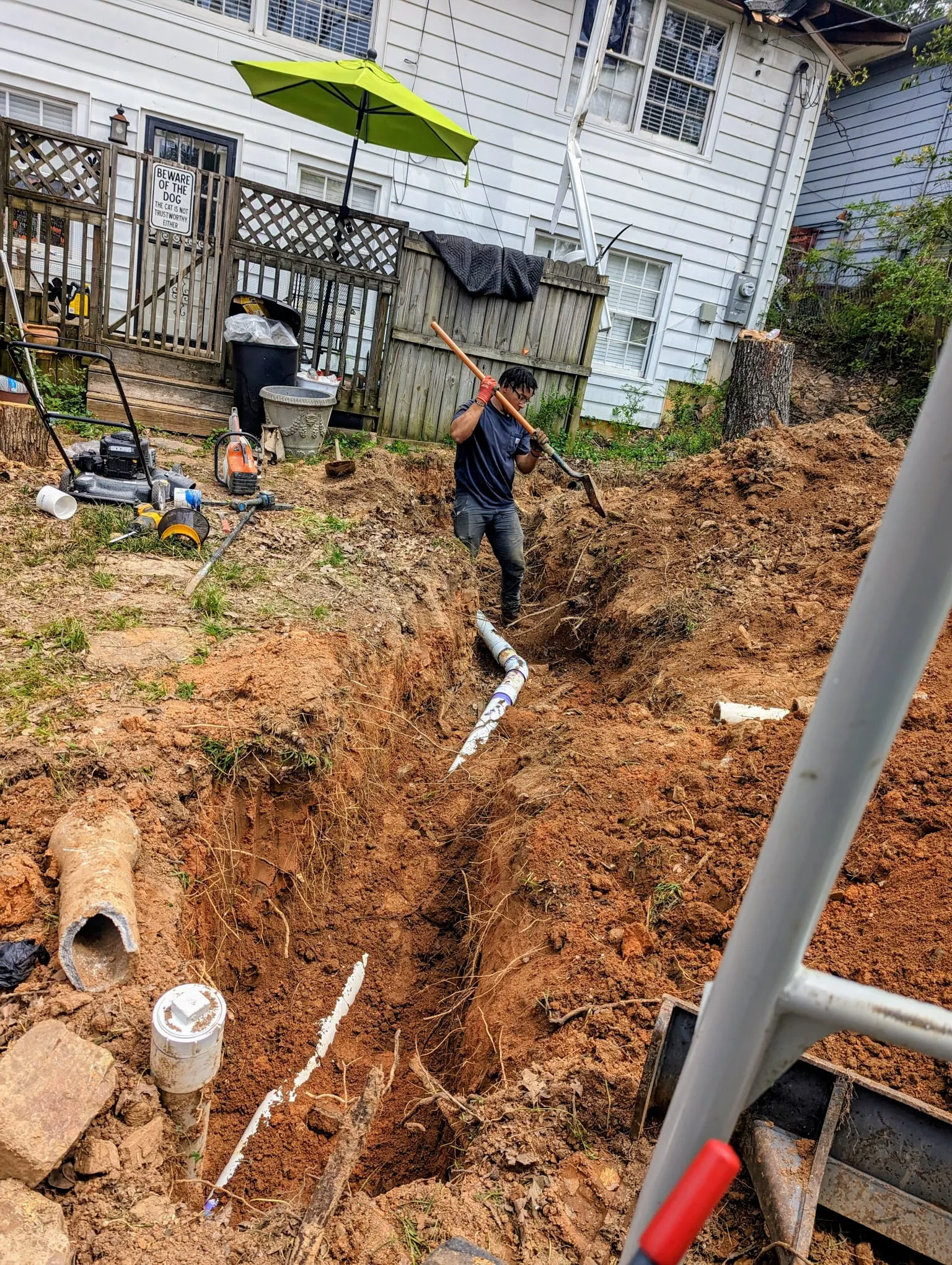 Trench dug to replace an old sewer line at a Cammack Village home
