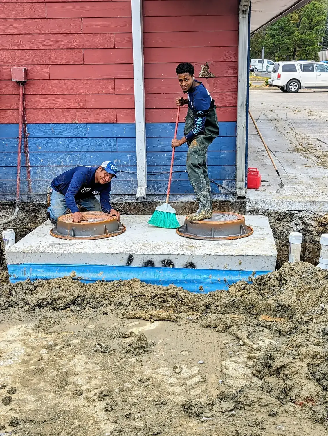 Diamond State Plumbing crew with a completed grease trap installation