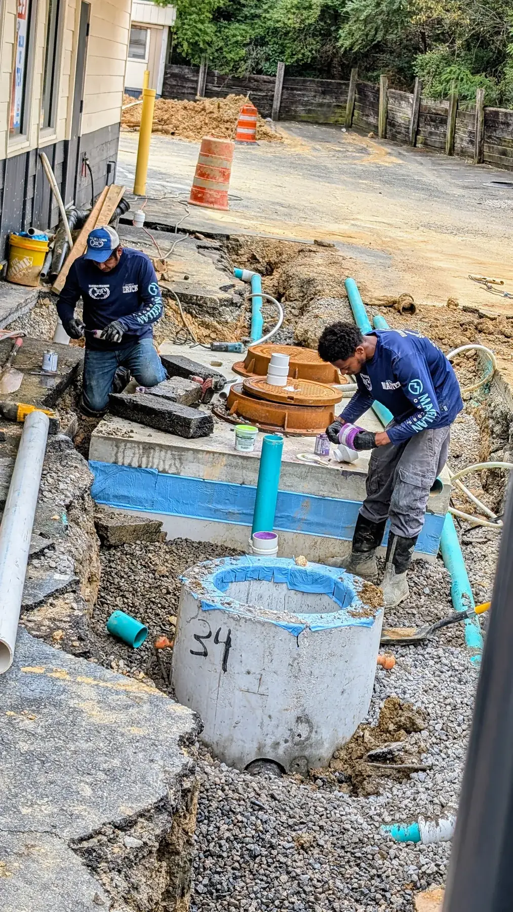 Diamond State Plumbing crew installing a commercial grease trap